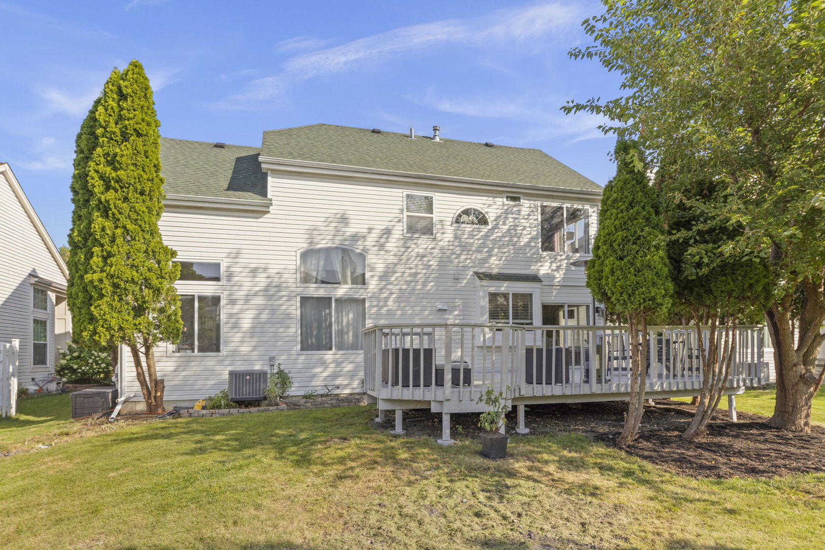 2132 Feldott Lane Naperville, IL 60540 - Photo 2 of 33 a view of a house with a wooden deck and a yard