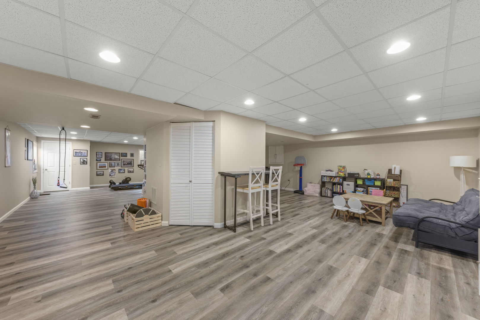 2132 Feldott Lane Naperville, IL 60540 - Photo 25 of 33 a view of a room with furniture and a wooden floor