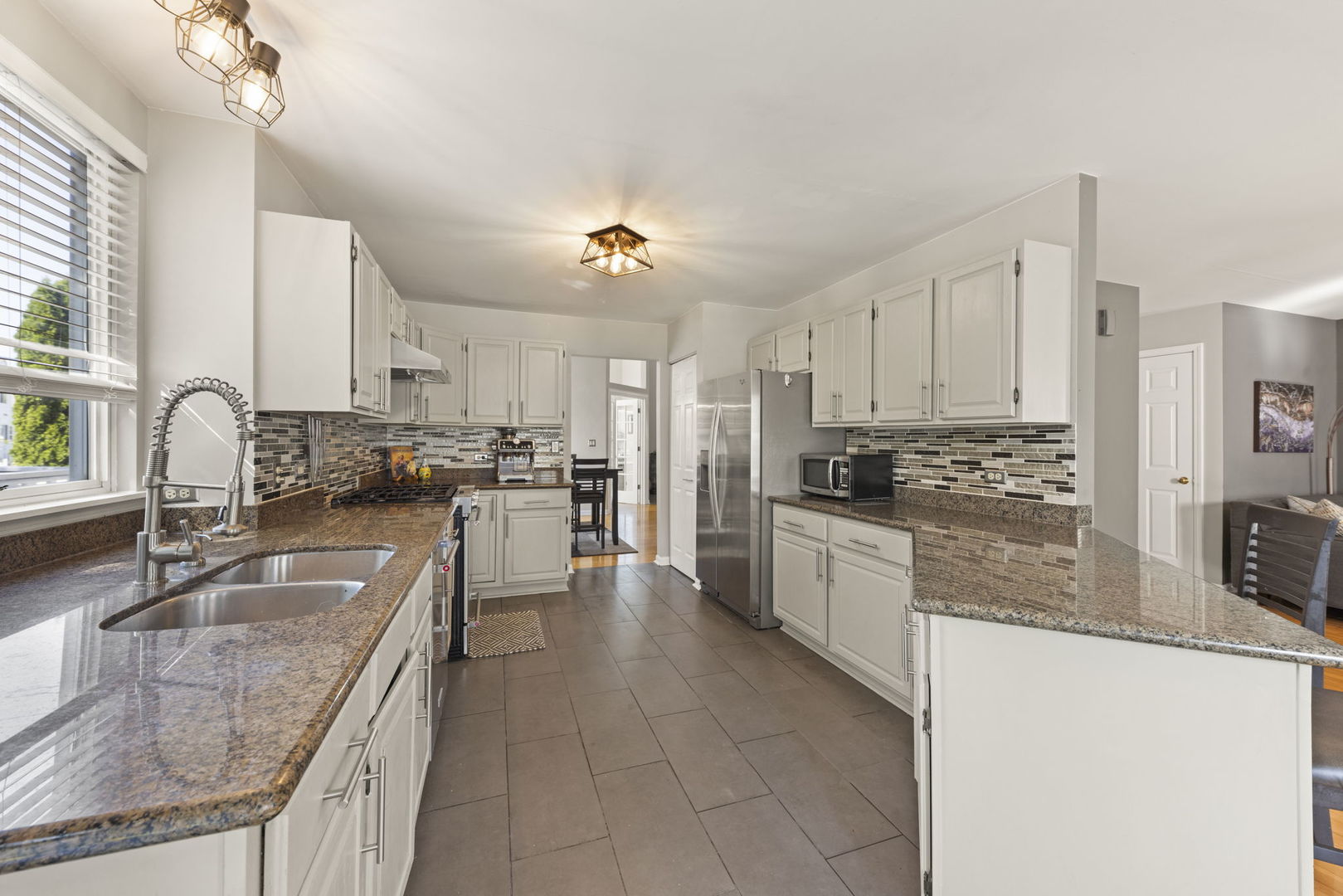 2132 Feldott Lane Naperville, IL 60540 - Photo 10 of 33 a kitchen with granite countertop a sink counter top space appliances and cabinets