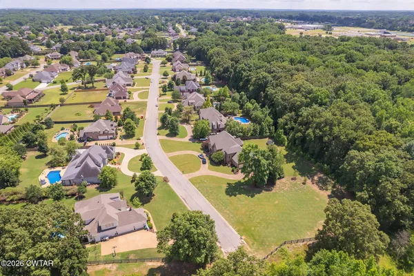 an aerial view of residential house with outdoor space