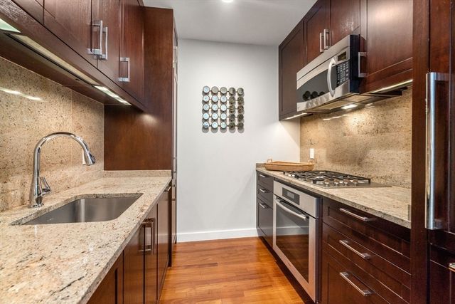 a kitchen with a stove and a sink