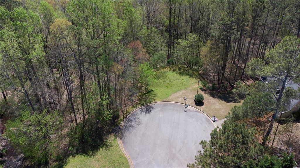 4225 Penion Point Cumming, GA 30028 - Photo 7 of 9 an aerial view of a house with a yard and trees