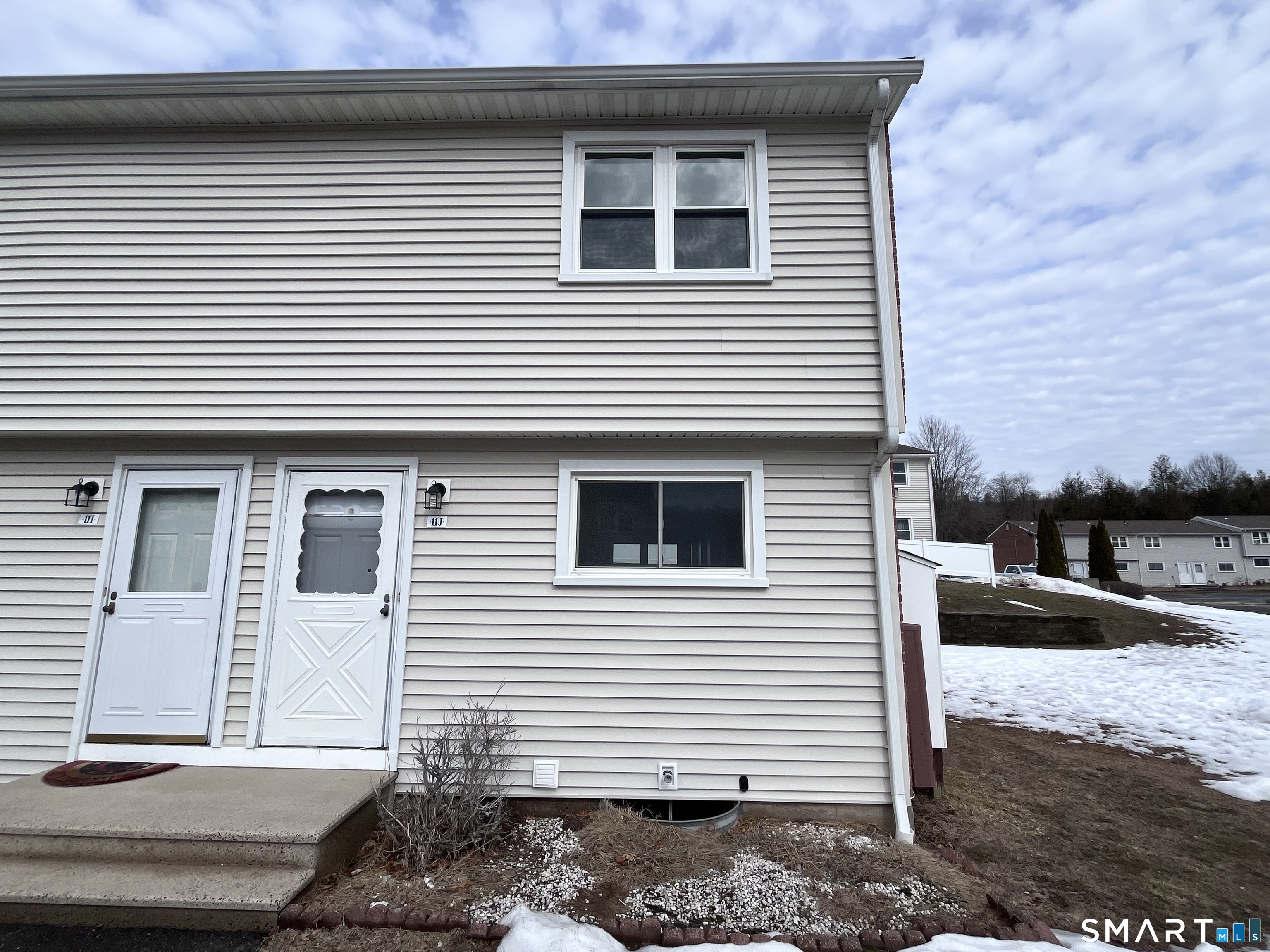 1081 New Haven Road, Unit 11J Naugatuck, CT 06770 - Photo 3 of 17 a side view of a house