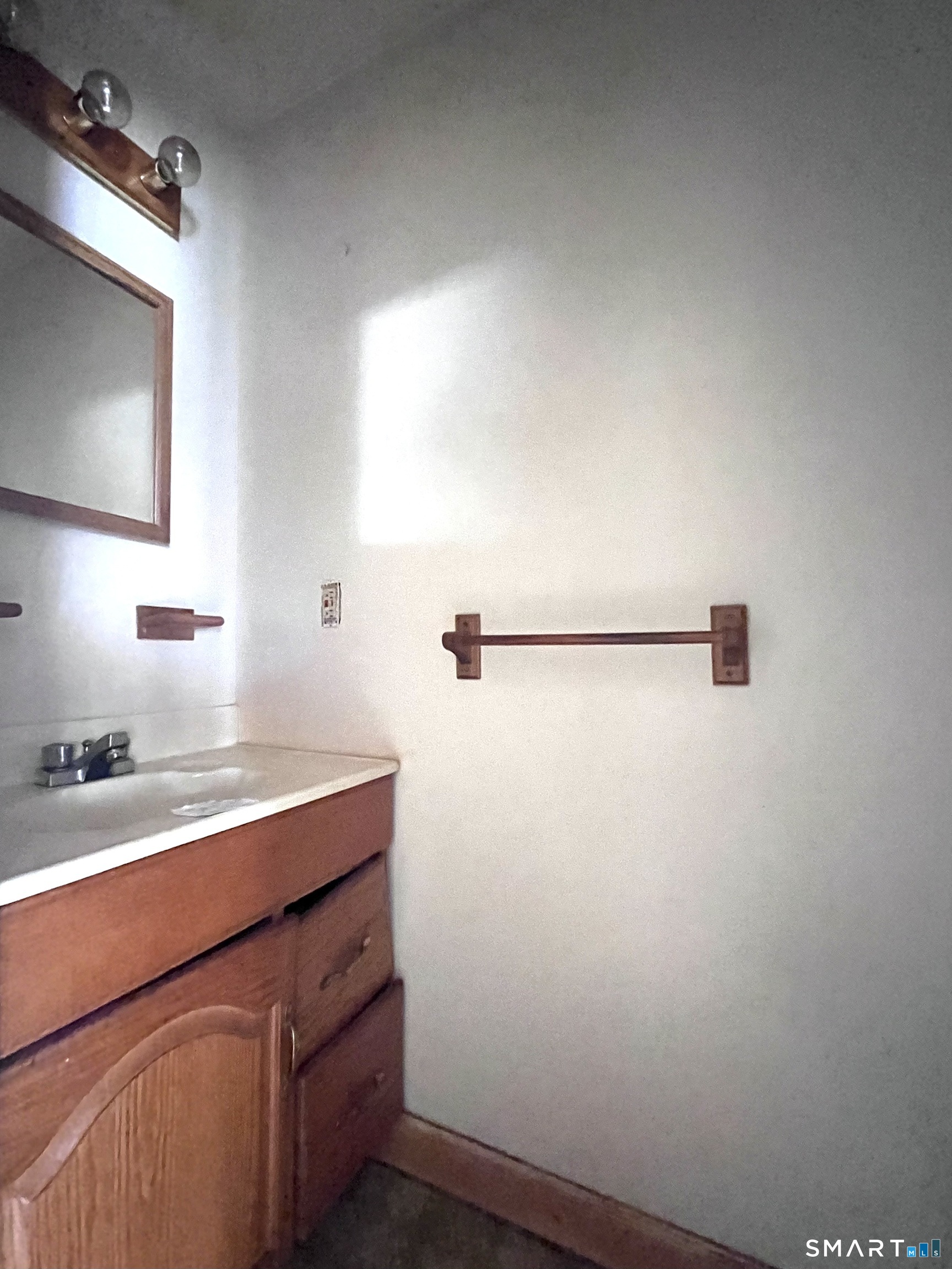 1081 New Haven Road, Unit 11J Naugatuck, CT 06770 - Photo 8 of 17 a bathroom with a sink and a mirror