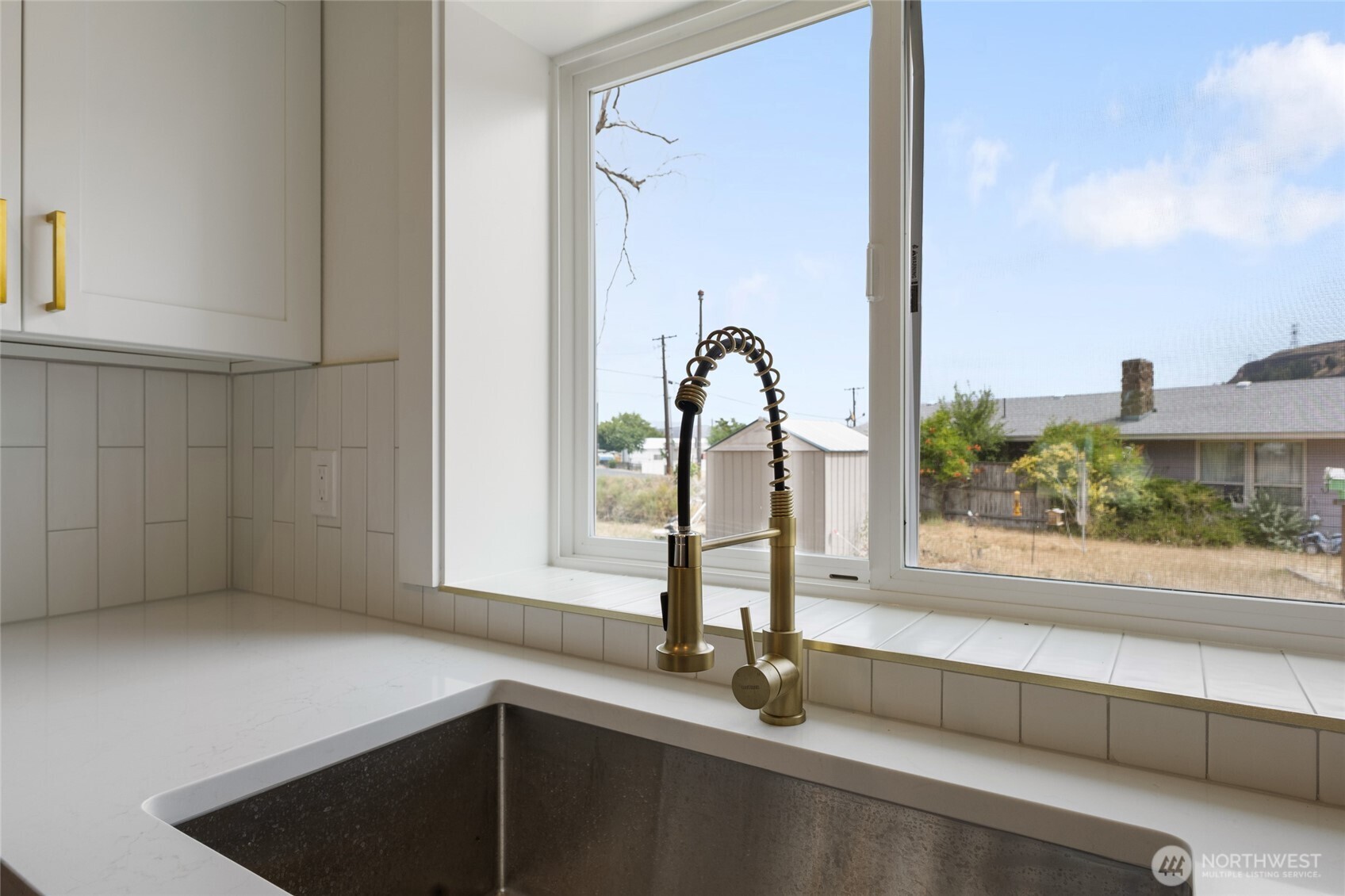 77 Diamond Street Electric City, WA 99123 - Photo 13 of 40 a close view of a faucet a sink and a window