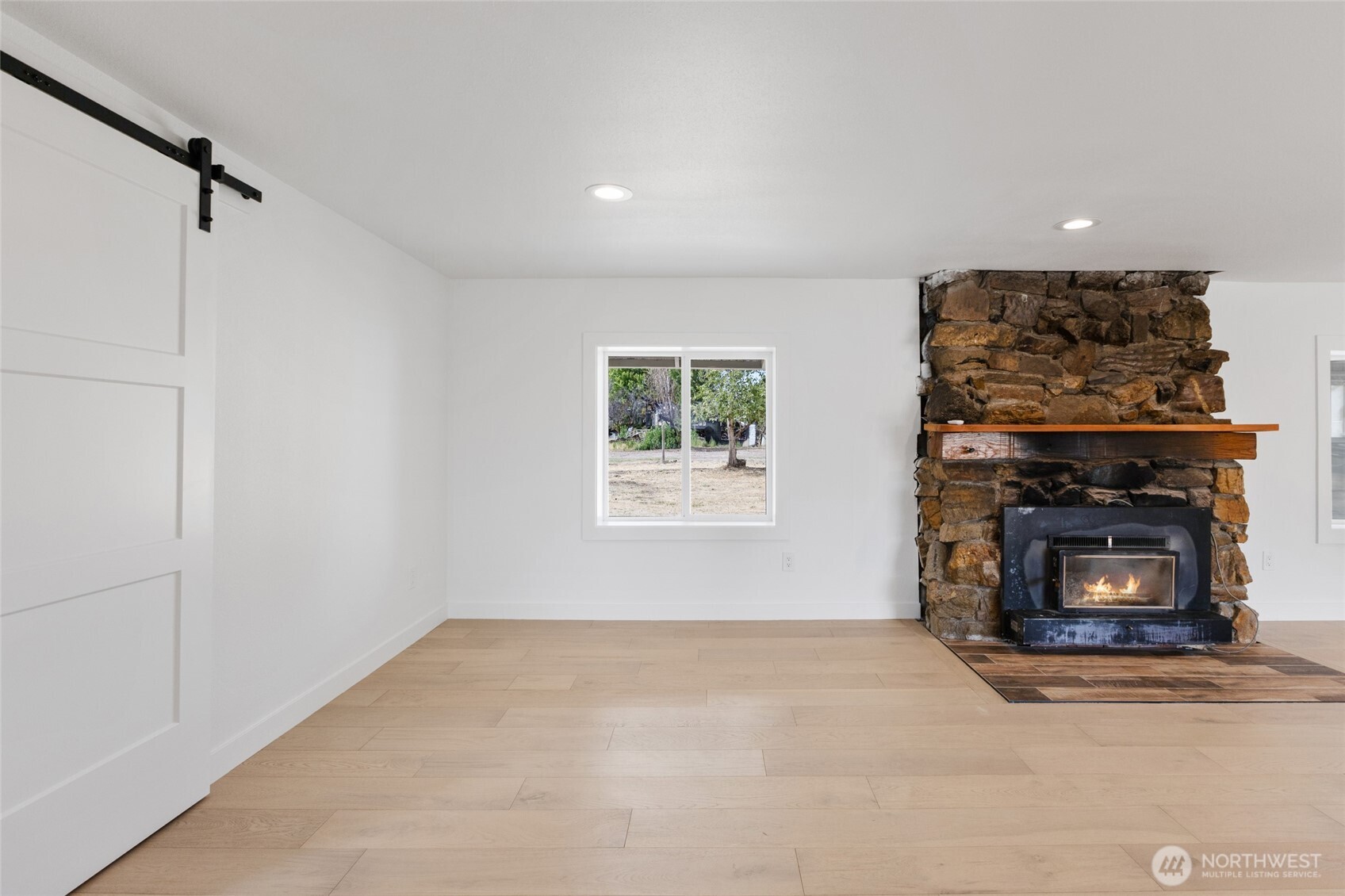 77 Diamond Street Electric City, WA 99123 - Photo 15 of 40 a view of an empty room with window and fire place
