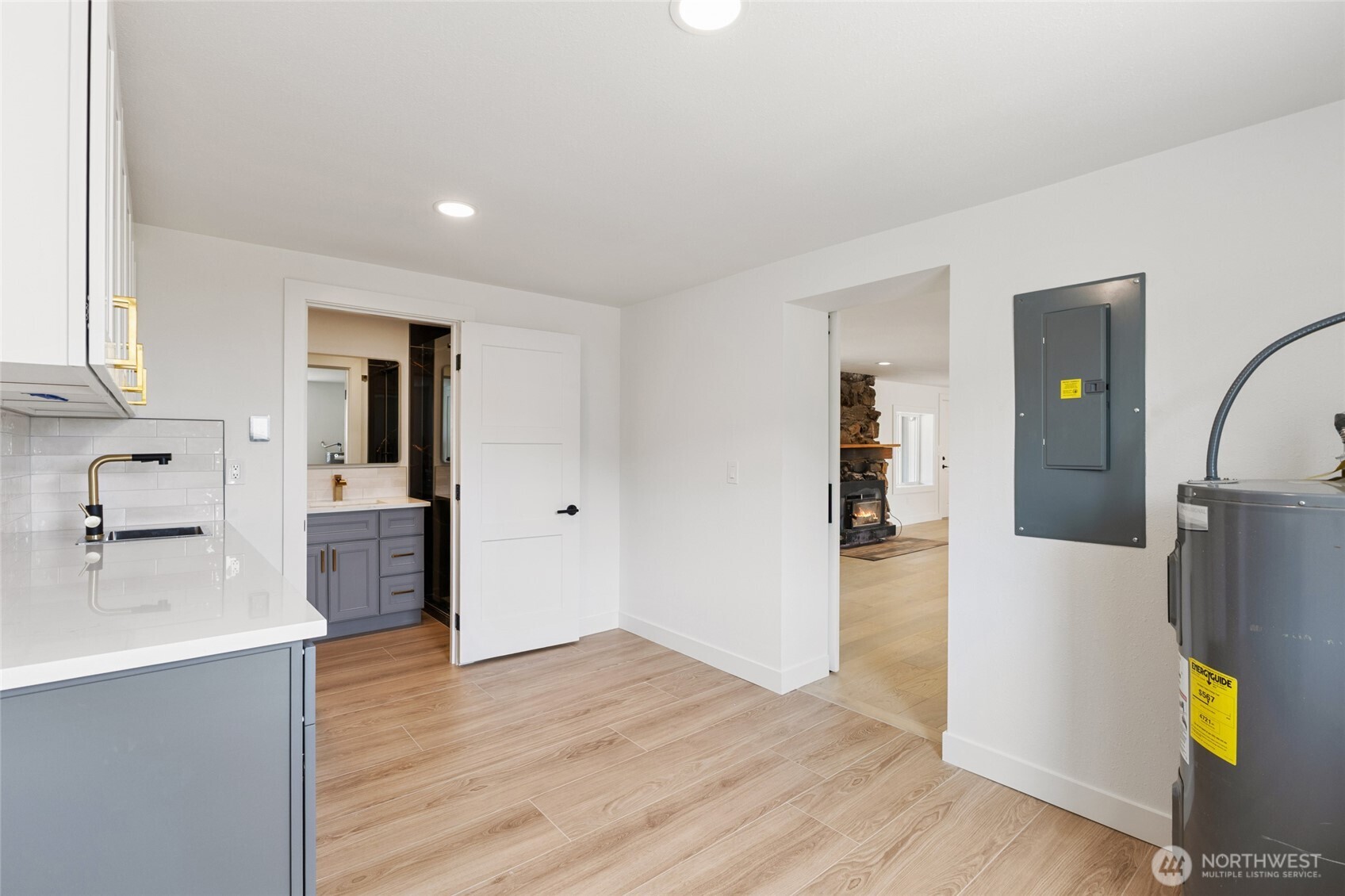 77 Diamond Street Electric City, WA 99123 - Photo 18 of 40 a view of a kitchen with wooden floor and electronic appliances