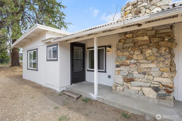a view of a white house with a large windows