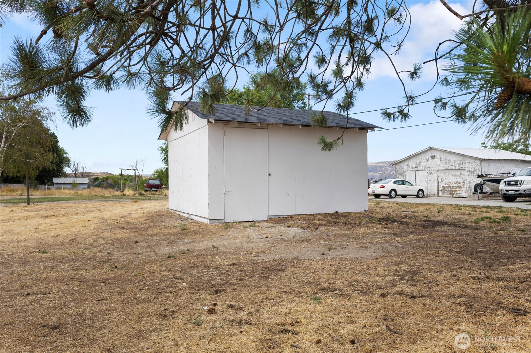 77 Diamond Street Electric City, WA 99123 - Photo 30 of 40 a view of a yard with a tree