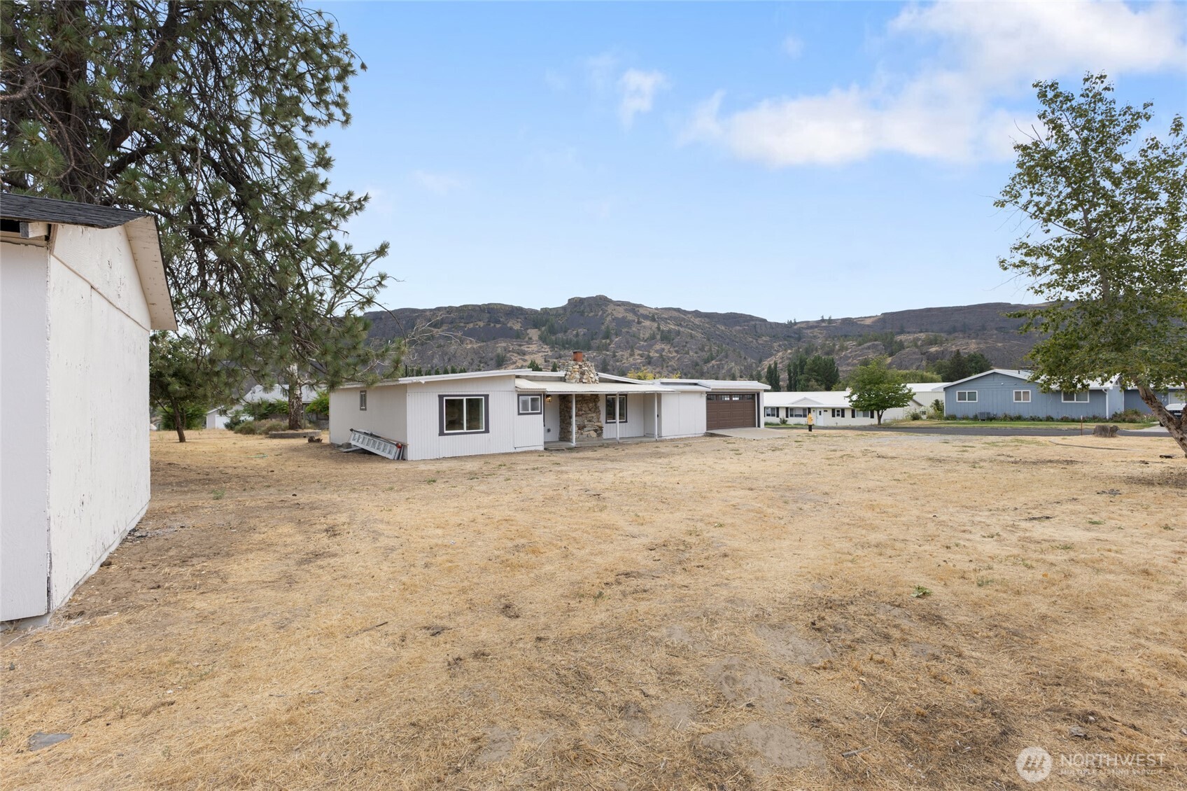 77 Diamond Street Electric City, WA 99123 - Photo 31 of 40 a view of a house with a yard