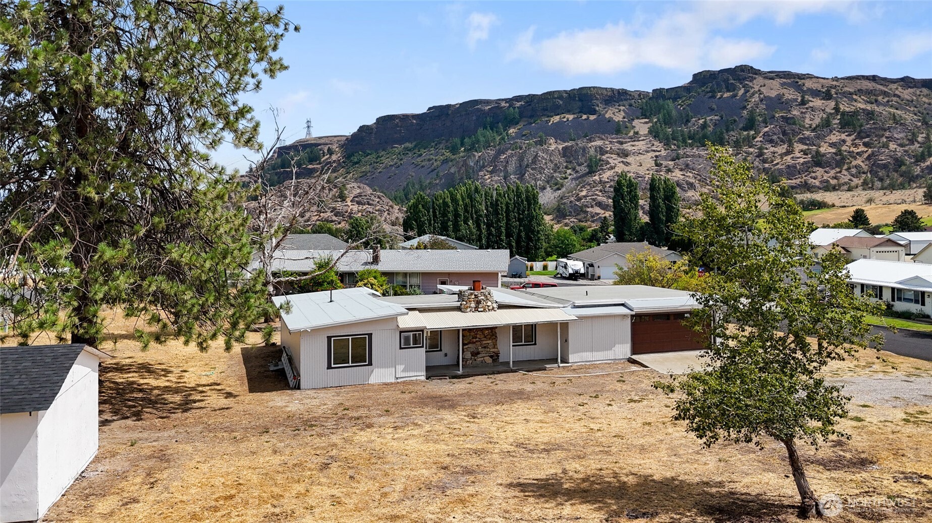 77 Diamond Street Electric City, WA 99123 - Photo 35 of 40 a view of a house with a mountain in the background