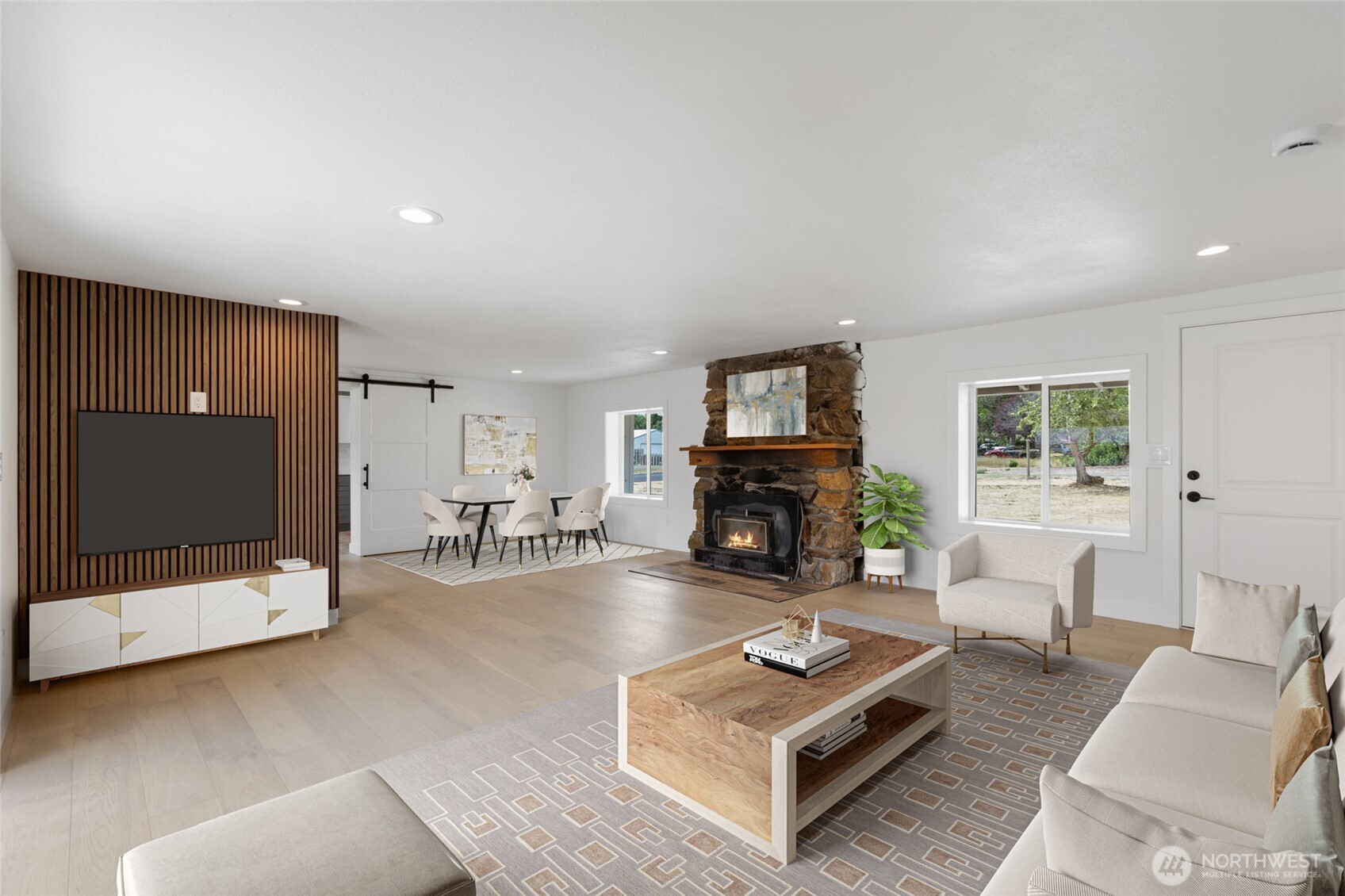 77 Diamond Street Electric City, WA 99123 - Photo 6 of 40 a living room with furniture a flat screen tv and a fireplace