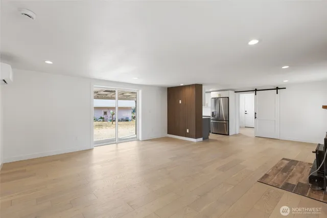 a view of an empty room with a window