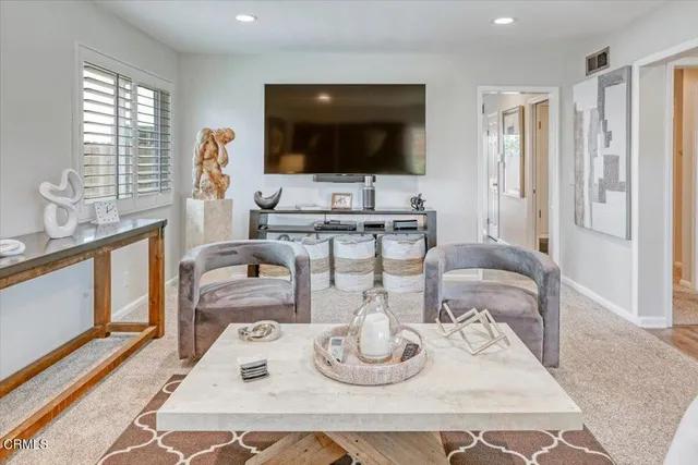 a kitchen with stainless steel appliances granite countertop a sink and a refrigerator