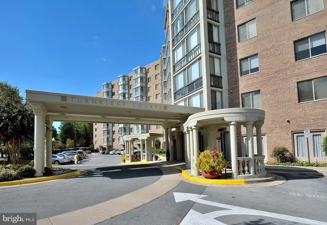 a front view of a house with a yard table and chairs