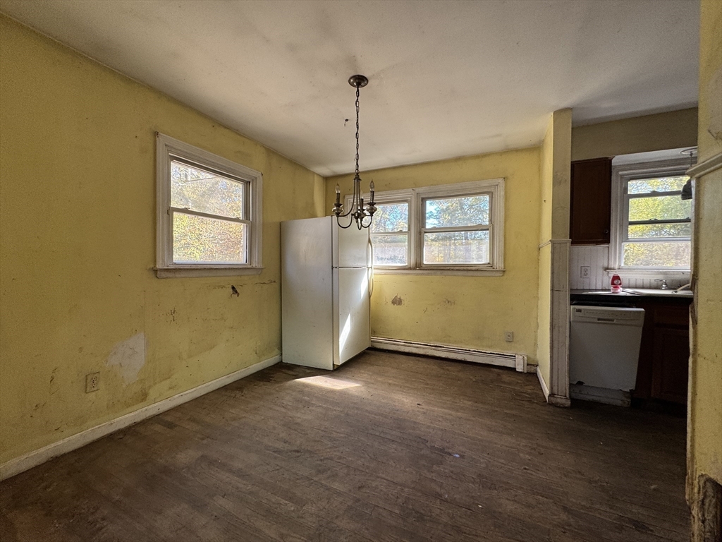 126 Alton Bradford Road Hopkinton, RI 02808 - Photo 14 of 19 a view of an empty room with window and kitchen view