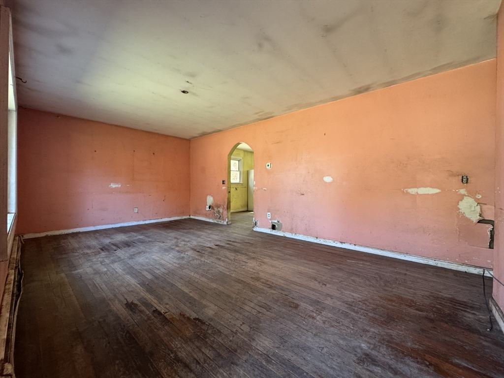 126 Alton Bradford Road Hopkinton, RI 02808 - Photo 17 of 19 an empty room with wooden floor and windows