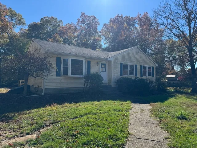 a front view of a house with a yard