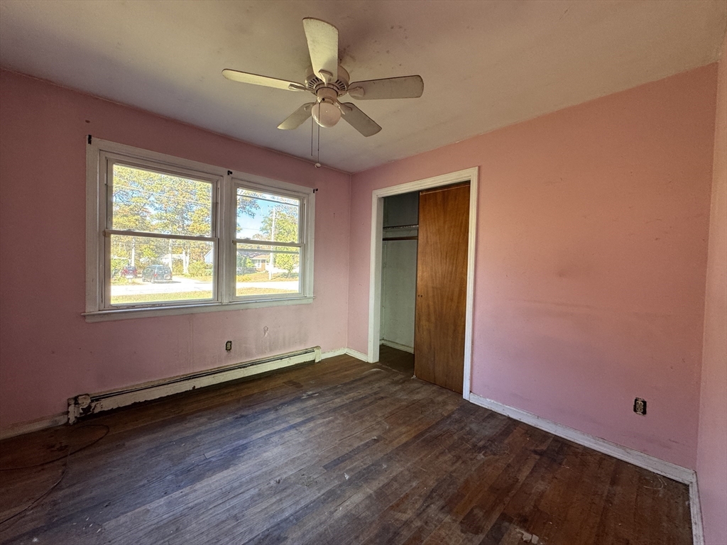 126 Alton Bradford Road Hopkinton, RI 02808 - Photo 10 of 19 a view of room with window ceiling fan and hardwood floor