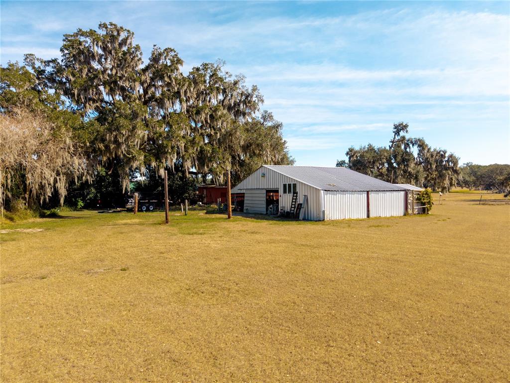 9504 Fort King Road Dade City, FL 33525 - Photo 5 of 51 a house view with swimming pool in front of it
