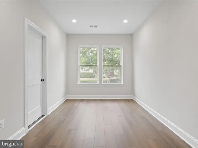 a view of kitchen with wooden floor and windows