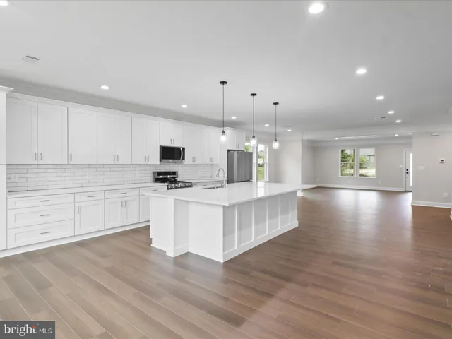 a view of a workspace with furniture and window