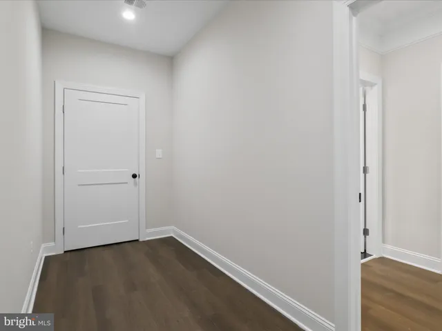 a spacious bedroom with a large bed and a window