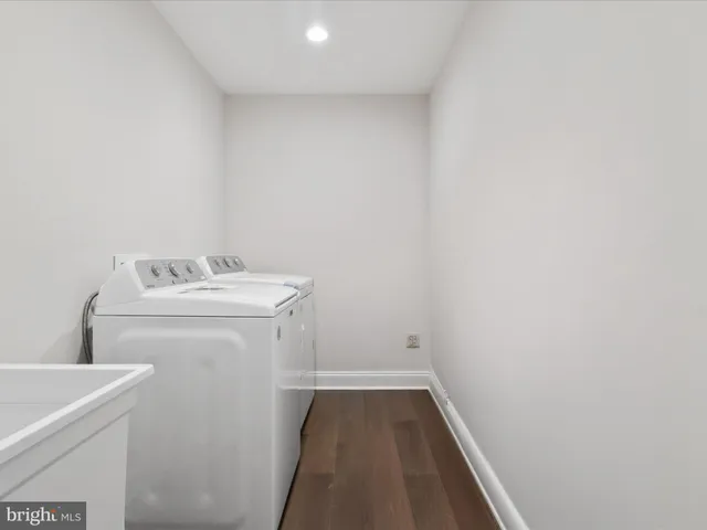 a spacious bathroom with double vanity sink mirror and shower