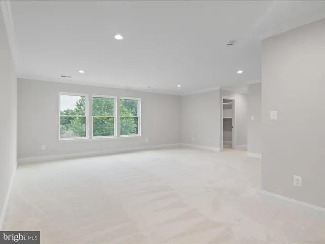 a view of a swimming pool with an outdoor space and seating area