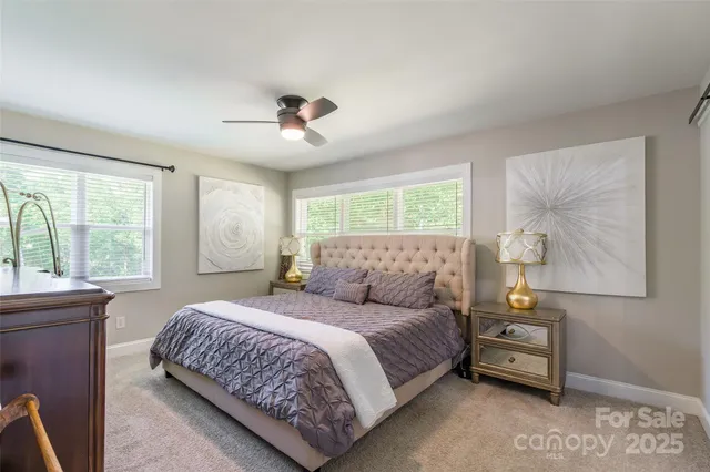 a bedroom with a bed and a night stand