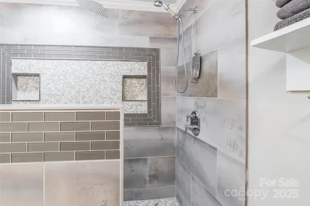 a bathroom with a bathtub and a shower