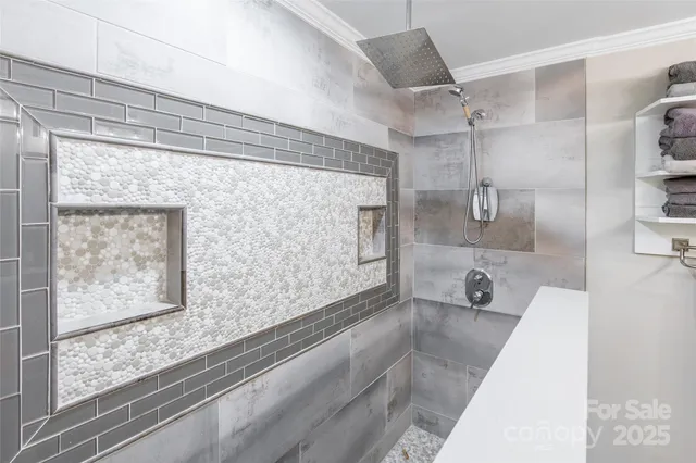 a bathroom with a bathtub and a shower