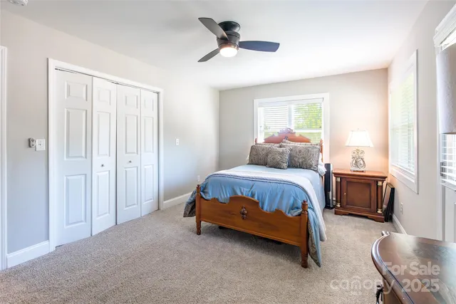 a bedroom with bed and window