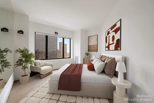 a bedroom with a bed and a couch