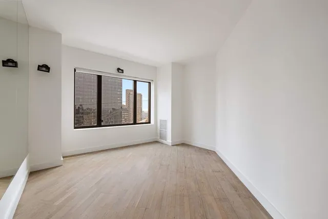 a view of an empty room with glass door