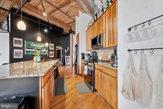 a kitchen with stainless steel appliances granite countertop lots of counter top space