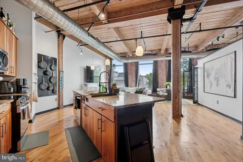 a kitchen with stainless steel appliances granite countertop lots of counter top space