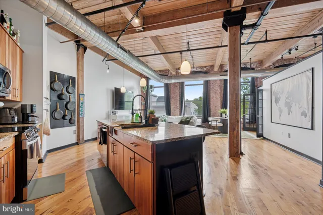 a kitchen with stainless steel appliances granite countertop lots of counter top space