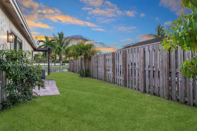 a garden with wooden fence