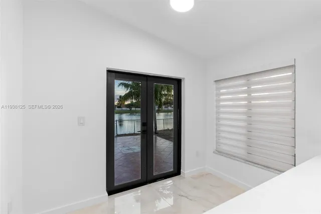 a view of an empty room and window