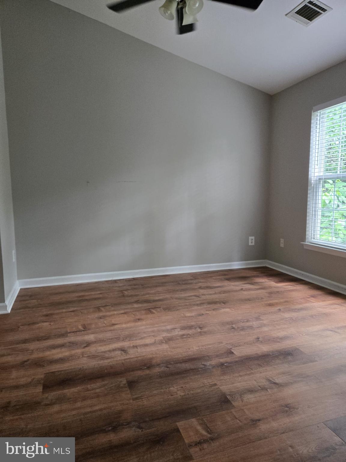 161 Ingle Place Alexandria, VA 22304 - Photo 18 of 21 a view of empty room with window and wooden floor