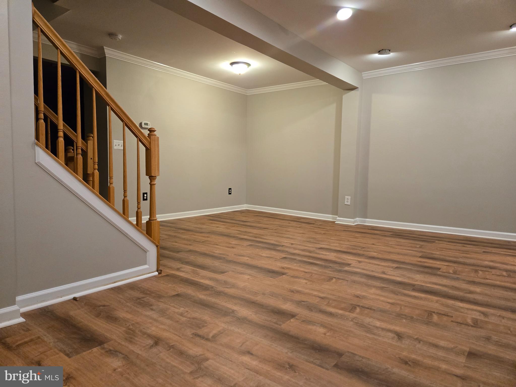 161 Ingle Place Alexandria, VA 22304 - Photo 10 of 21 a view of an empty room with wooden floor and windows