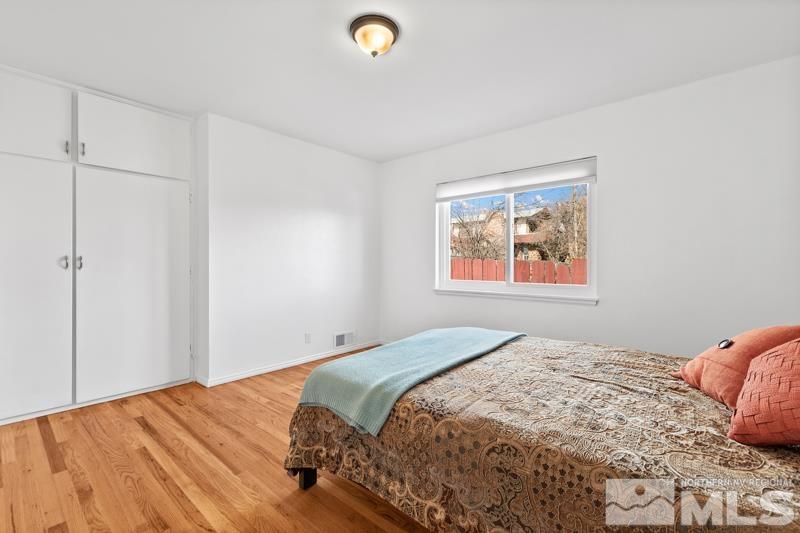 1051 Keystone Avenue Reno, NV 89503 - Photo 14 of 25 a bedroom with a bed and a window
