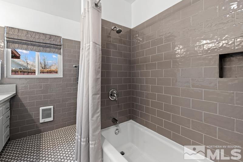 1051 Keystone Avenue Reno, NV 89503 - Photo 15 of 25 a bathroom with a bathtub and shower