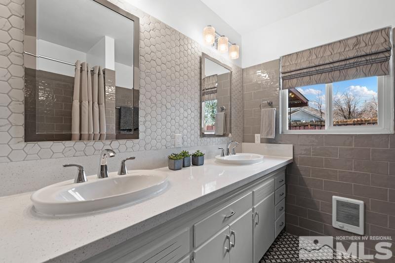 1051 Keystone Avenue Reno, NV 89503 - Photo 17 of 25 a bathroom with a double vanity sink and a mirror