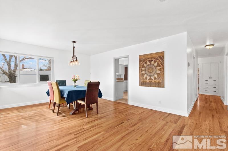 1051 Keystone Avenue Reno, NV 89503 - Photo 5 of 25 a view of a dining room with furniture window and wooden floor