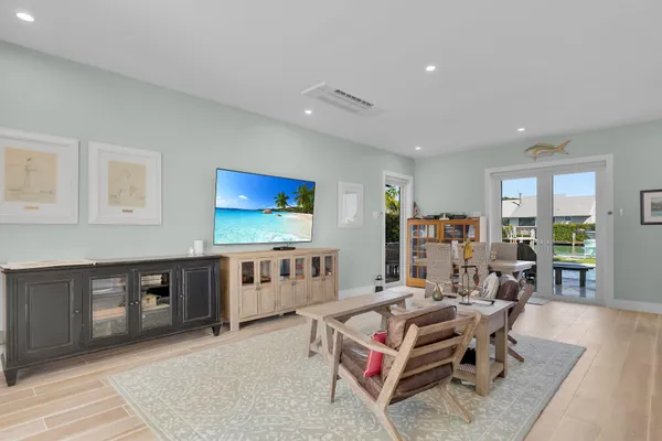 a view of a sink and dishwasher with wooden floor