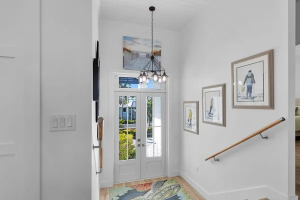 a view of a balcony with dining table and chairs