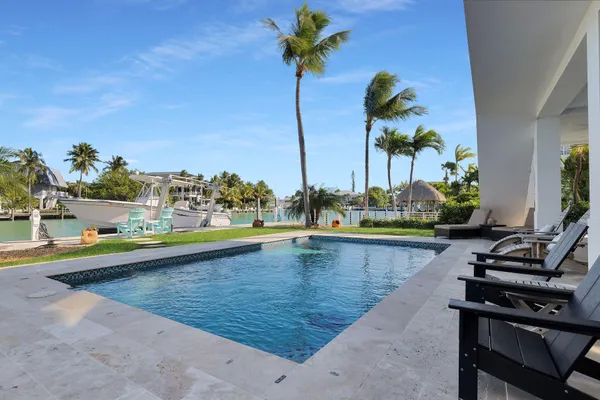 a en suite bathroom with a double vanity sink and a mirror