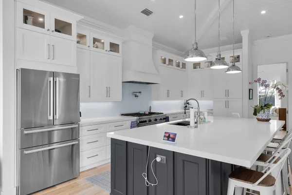 a bathroom with a granite countertop sink a toilet and a mirror